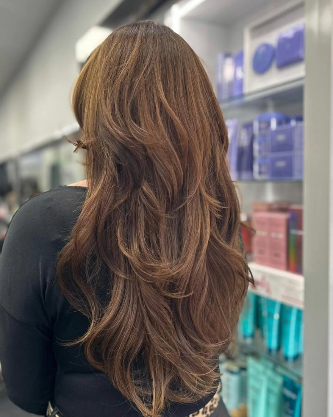 long layered hair cut with shorter textured layers at the crown